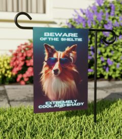 Beware of Sheltie - Banner For Your Yard A colorful photo of a dog wearing glasses, with the text "Beware of the Sheltie, extremely cool and shady" written in bold letters.