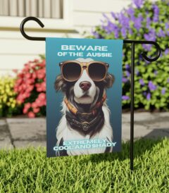 Beware of Aussie - Banner For Your Yard A colorful photo of a dog wearing glasses, with the text "Beware of the Aussie, extremely cool and shady" written in bold letters.